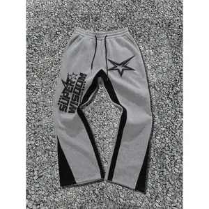 Men’s colorblock pants with star and letter print, drawstring waist, regular fit street fashion, pocket trousers for fall and winter—men’s bottoms for everyday wear