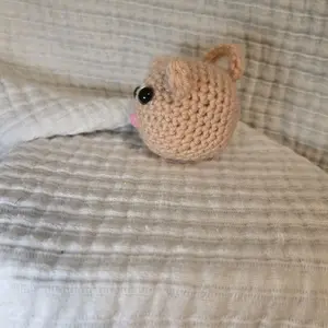 Handcrafted Crochet Mini Pocket Pal - Adorable Corral Amigurumi with Black Eye and Pink Nose
