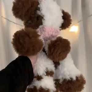 Crochet fluffy cow snuggler
