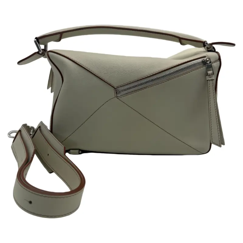 Pre-owned Loewe Used Puzzle bag, light beige calf leather, geometric puzzle design, top handle, adjustable crossbody strap, silver hardware