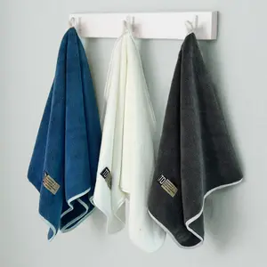 4pcs  towels, coral fleece towel 40 * 80cm, fast drying and low fluff, five-star hotel grade, easy to hang - blue, white, dark blue, with "D" label.