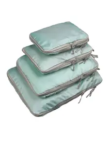 4-Piece set of compressible travel storage bags for organizing clothes and pants. These portable luggage organizers, Travel Packing Cubes, are perfect for use during trips and vacations.