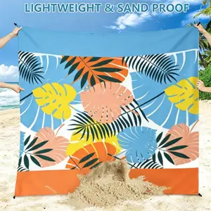 Large Beach Mat with Tropical Leaf Print, Waterproof and Quick-Dry, Foldable and Lightweight, Includes Storage Bag and Stakes