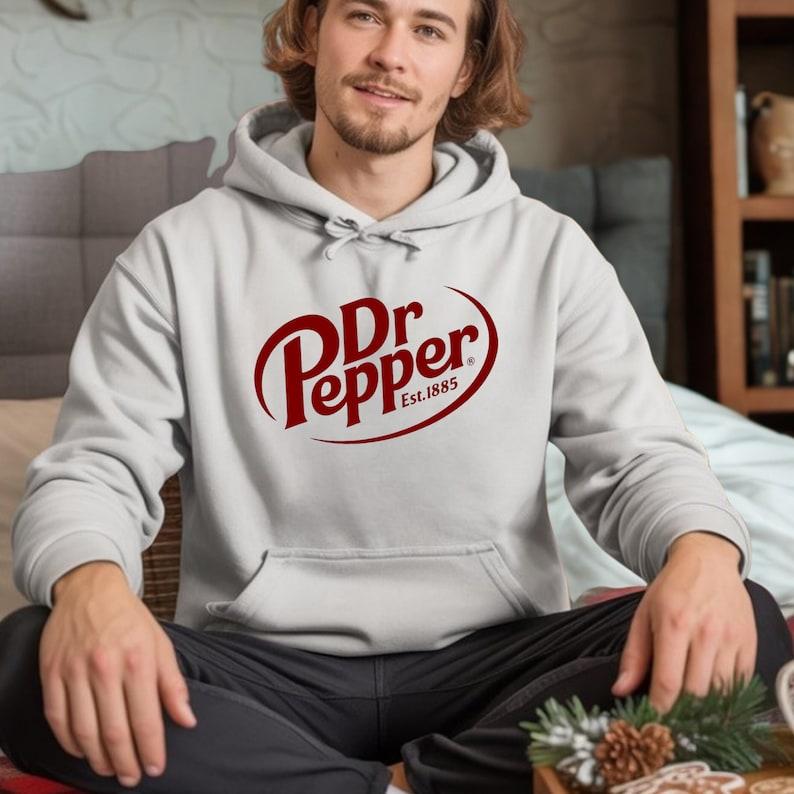 Dr Pepper Unisex Hoodie – Retro Vintage Style, Cozy Hoodie, Perfect Gift for Men & Women, Soda Lover Merch, Versatile Unisex Wear