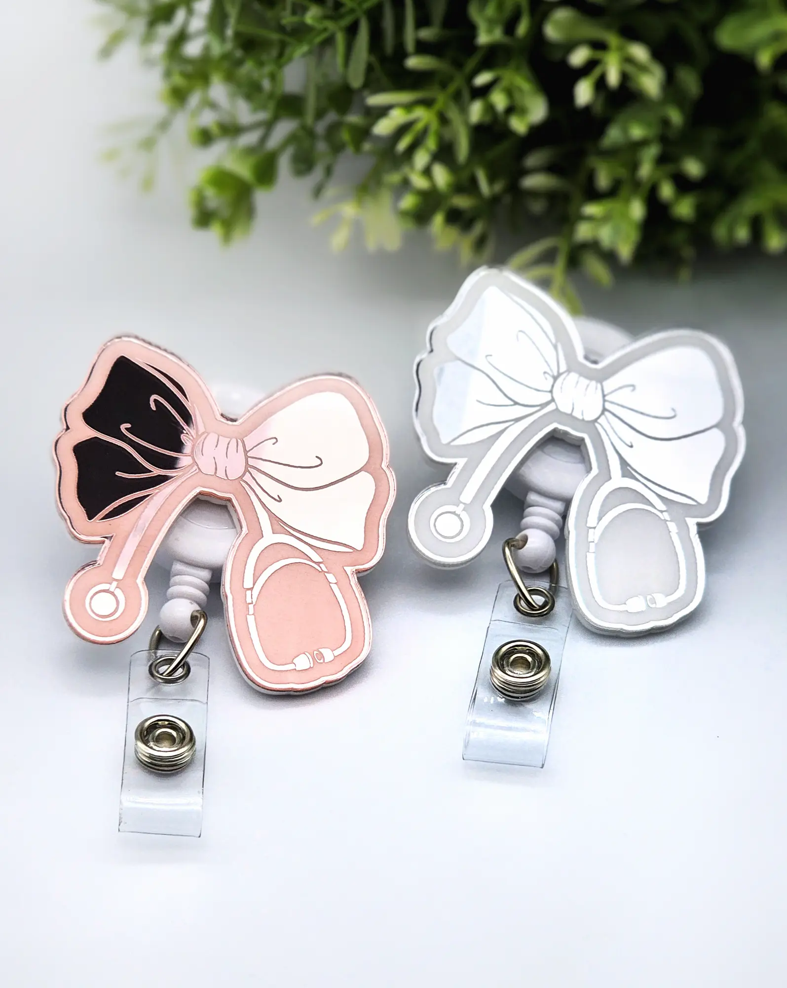 Bow with Stethoscope Badge Reel, Laser Engraved with Smooth Mirror Finish, Funny Badge reel for nurses, xray techs and hospital workers. Retractable swivel clip with a 360 rotation. Great gift for coworker. Cute Badge for Work. Badge clip, Badge pull