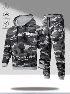 A men's military green camouflage activewear set with an outdoor energetic style, featuring a hooded design and vibrant camouflage pattern. Eye catching "USA" lettering and small flag prints add a youthful touch. The top has a large pocket for storing gea