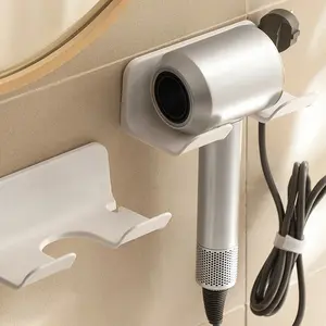 1pc Wall-mounted hairdryer holder Bathroom organizer Durable plastic storage rack Simple design Helps achieve a tidy and stylish bathroom organization Bathroom sorting and storage