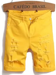 Summer streetwear brand men’s shorts: bright yellow denim shorts with a structured fit, made from pure cotton twill denim; vintage wash with distressed details and frayed edges; textured design with metal reinforcement hardware; loose straight cut, mid-le
