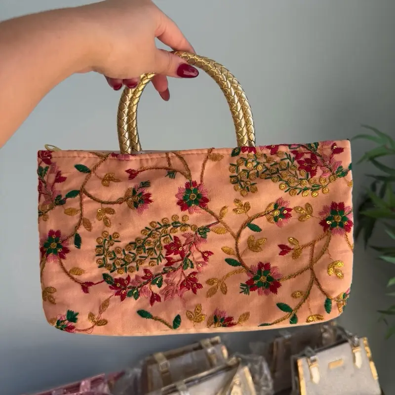 Rosy Peach Dream Handbag with Embroidered Floral Design and Gold Handles for Elegant Occasions