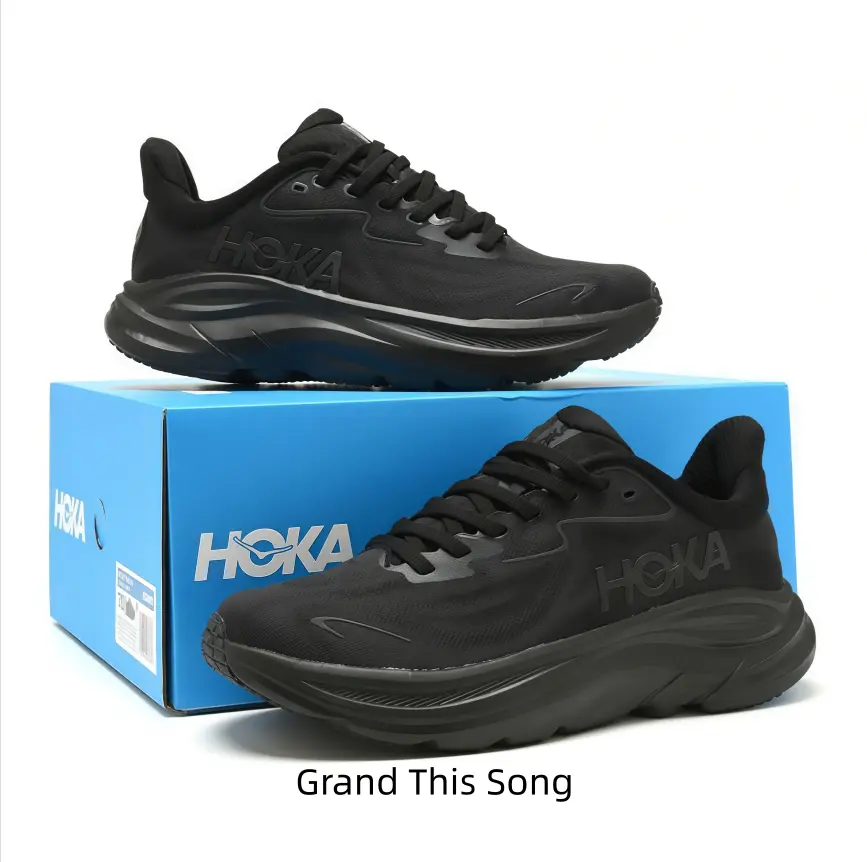 All-black low-top running sneakers, lightweight engineered mesh upper, signature sculpted thick cushion midsole, minimalist monochrome design. Versatile daily trainer ideal for running and casual street fits.