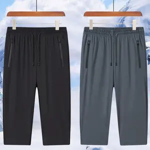 Men’s summer high-stretch ice silk quick-dry athletic shorts — trendy, versatile, minimalist design with letter print, zippered pockets, loose straight cut, elastic waistband with drawstring, 7/8 length; suitable for fitness, workouts, commuting, and basi