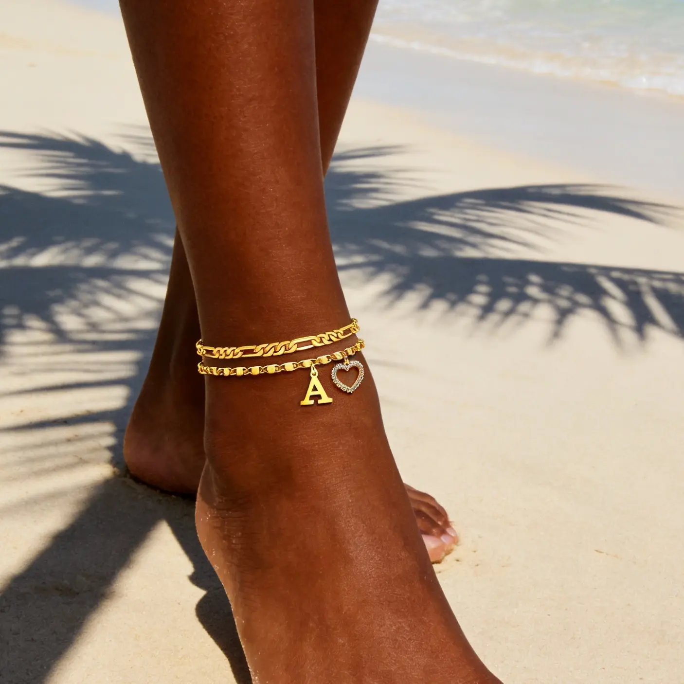 2-Piece Layered Initial Anklet Set for Women, Gold or Silver Tone Figaro Chain Ankle Bracelets with Letter, Heart and Sparkling Charms, Adjustable Everyday Accessory