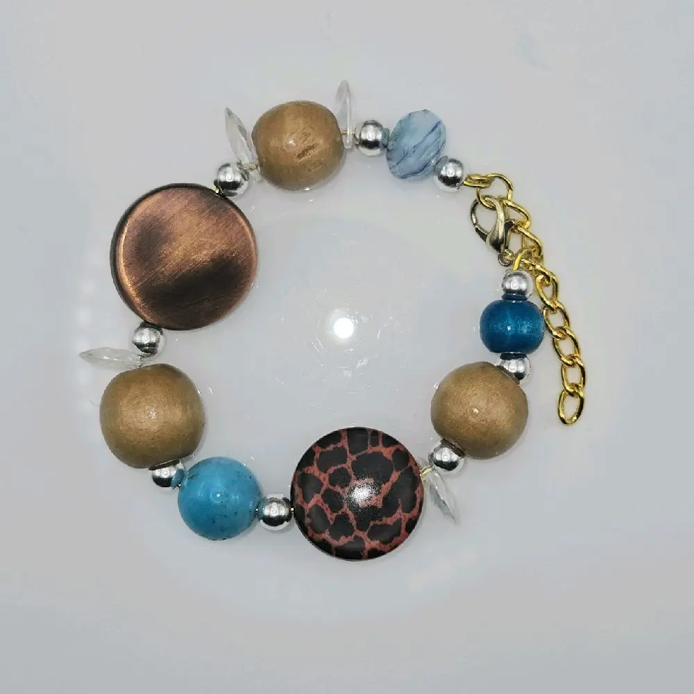 Stackable: Wooden Beaded, bracelet with blue, brrown and golden accents. Has clasp expandable closure.