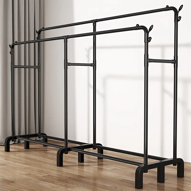 freestanding metal coat rack, with a storage shelf at the bottom and side hooks for hangingbags. Suitable for hanging and storing clothes in the bedroom, entryway, and laundry room;can be used to hana dresses.shirts. and baas