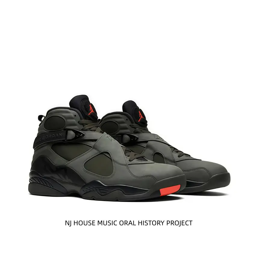 Military green suede high-top sneakers with bright red toe accent and red tongue logo. Adjustable strap supports ankles steadily, cushioned midsole fits streetwear and daily casual wearing perfectly.