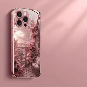 A phone case with pink floral design featuring a pink metallic finish and tempered glass material compatible with various iPhone models including the iPhone 17 series and earlier versions