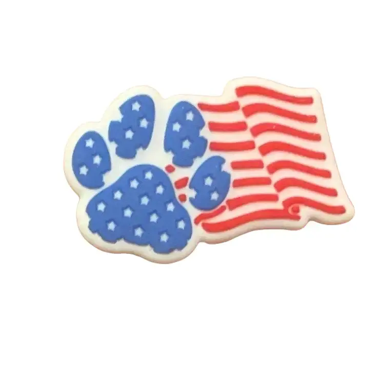 Silicone 30 MM Paw Print Flag made by 101721. This custom focal bead is perfect for pens, keychains, lanyards and charms!