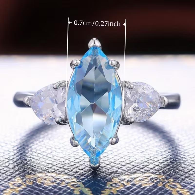 Elegant Three-Stone Wedding Band Featuring a Marquise Cut Blue Zirconia, Perfect for Proposals, Anniversaries, And Everyday Wear
