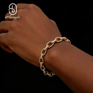 14k Cuban Link Bracelet, Brass Material | 14K Gold Plated, Set with Cubic Zirconia Gemstones, A Versatile Piece of Jewelry Suitable for Any Outfit.