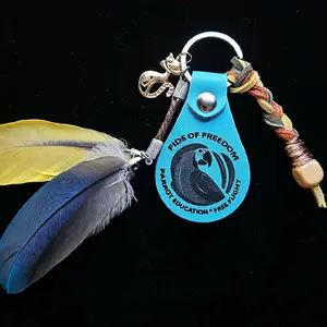 FIDS OF FREEDOM Baby Blue Kitty Leather Feather Keychain with Parrot Education Free Flight Logo and Colorful Cord