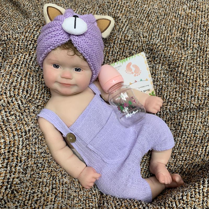 18-inch Rebirth Doll Full Body Soft Silicone Realistic Newborn Girl Doll with Purple Cat Ears Clothes Accessories Perfect Christmas Gift for Collections Holidays Birthdays Halloween Suitable for Children Over 3 Yearsold