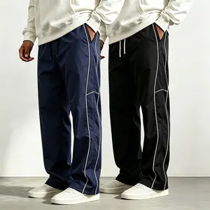 One piece men’s nylon sports casual pants with an elastic waistband and drawstring, side stripes, straight-leg long pants—suitable for sports and leisure. polyester fabric