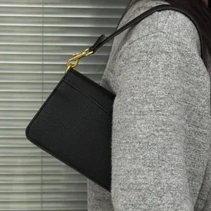 Vintage brown underarm bag, women's lychee-texturedcowhide shoulder bag with crescent lock clasp.