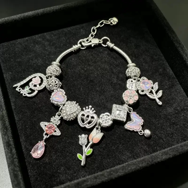 Elegant Charm Bracelet with Pink & Silver Charms, Heart, Flower, & Butterfly Designs, Perfect for Gift-Giving