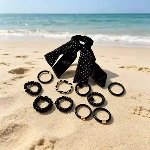 Soft elastic black hair tie paired with a large bow scrunchie