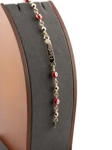 Beautiful 6-inch baby bracelet featuring a red Turkish evil eye, crafted in gold laminate. It is fully customizable. Please include the name in a note or message.