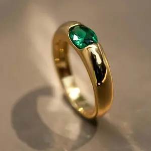 18k gold-plated ring in European & American style, set with green glass stones, suitable for everyday wear and as a gift.