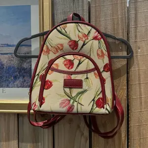 Vintage tulip floral patterned canvas back pack with a red leather trim