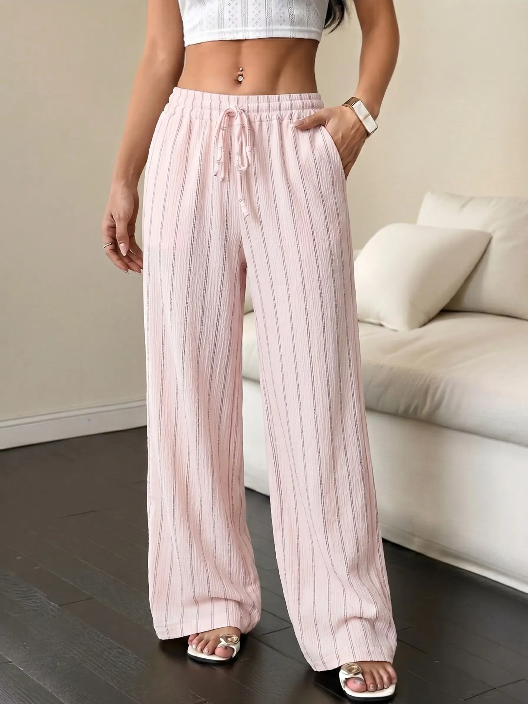 Women’s lightweight striped wide leg pants with a drapey feel and a comfortable elastic waistband with drawstring; versatile casual style suitable for home, beach, vacations, and more—an essential piece for summer outfits.