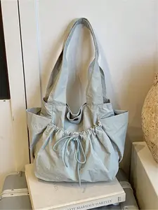 Lazy style drawstring drawstring tote bag with soft silhouette, drawstring details, and side pockets, can be carried on one shoulder or under the armpit, suitable for daily commuting, school, and shopping, with a gentle and relaxed atmosphere. Whoever car