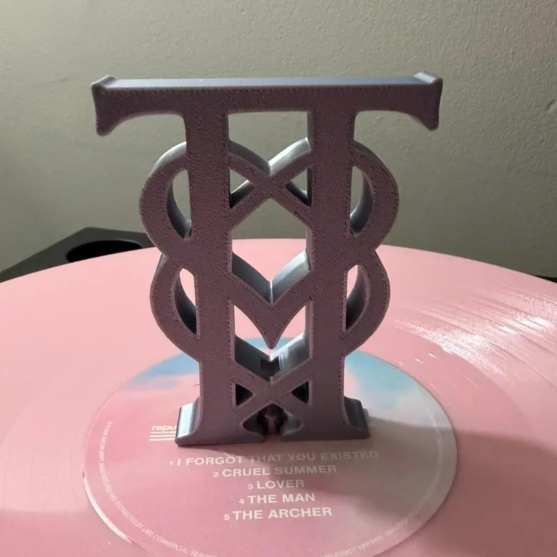 TT monogram charm
