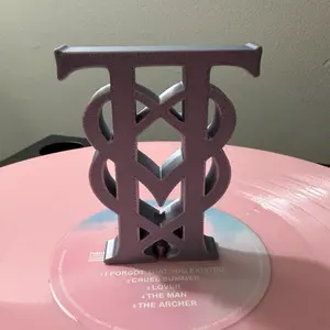 TT monogram charm