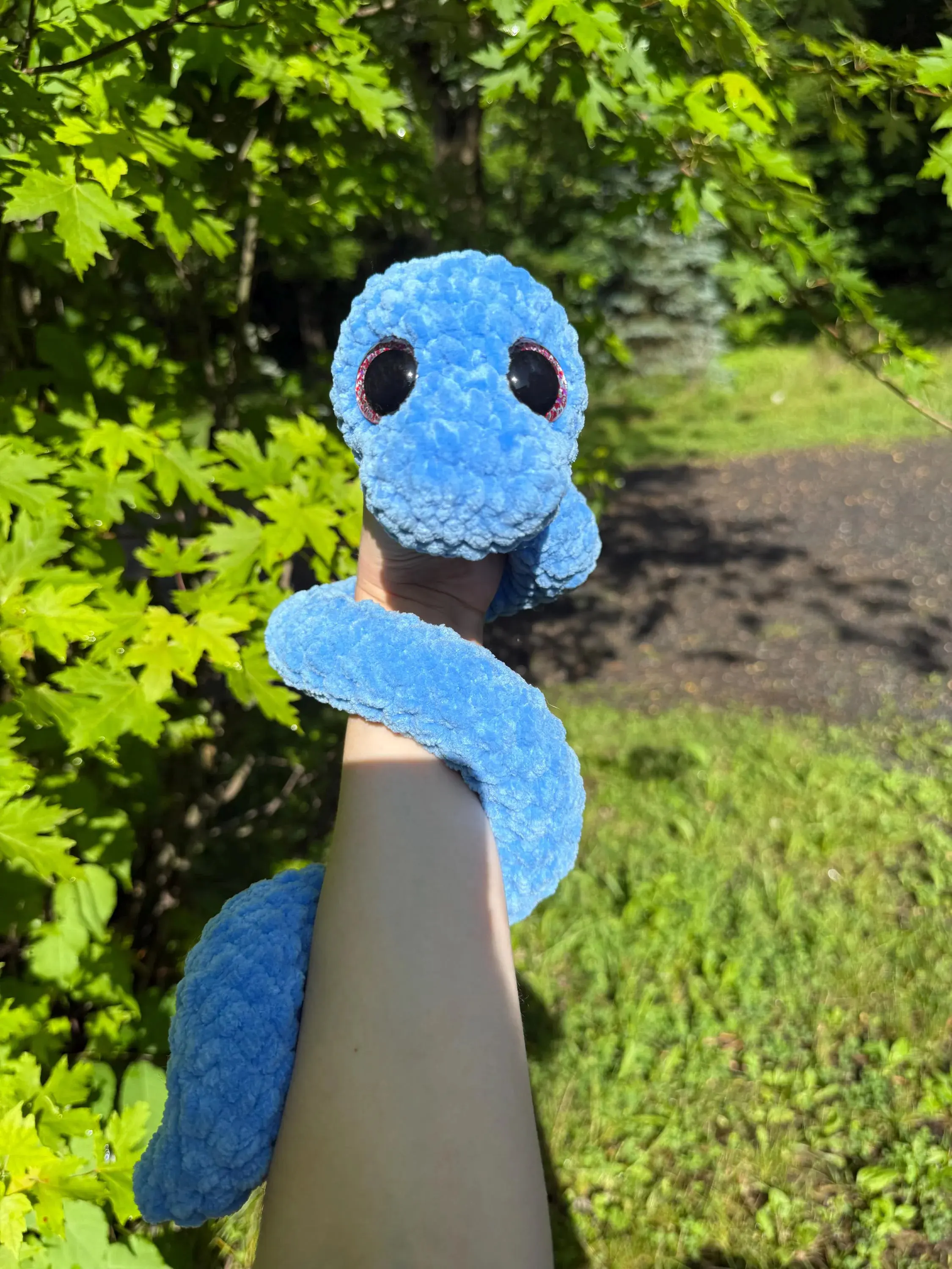 Adorable Blue Crocheted Snake with Large Eyes