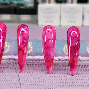 Magenta and purple alcohol ink salon quality press on nails.