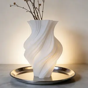 This stylish and artistic spiral vase is perfect for displaying dried flowers and can be placed on a coffee table or desk in the living room to create a festive atmosphere. It's an ideal gift or decoration for the holidays.