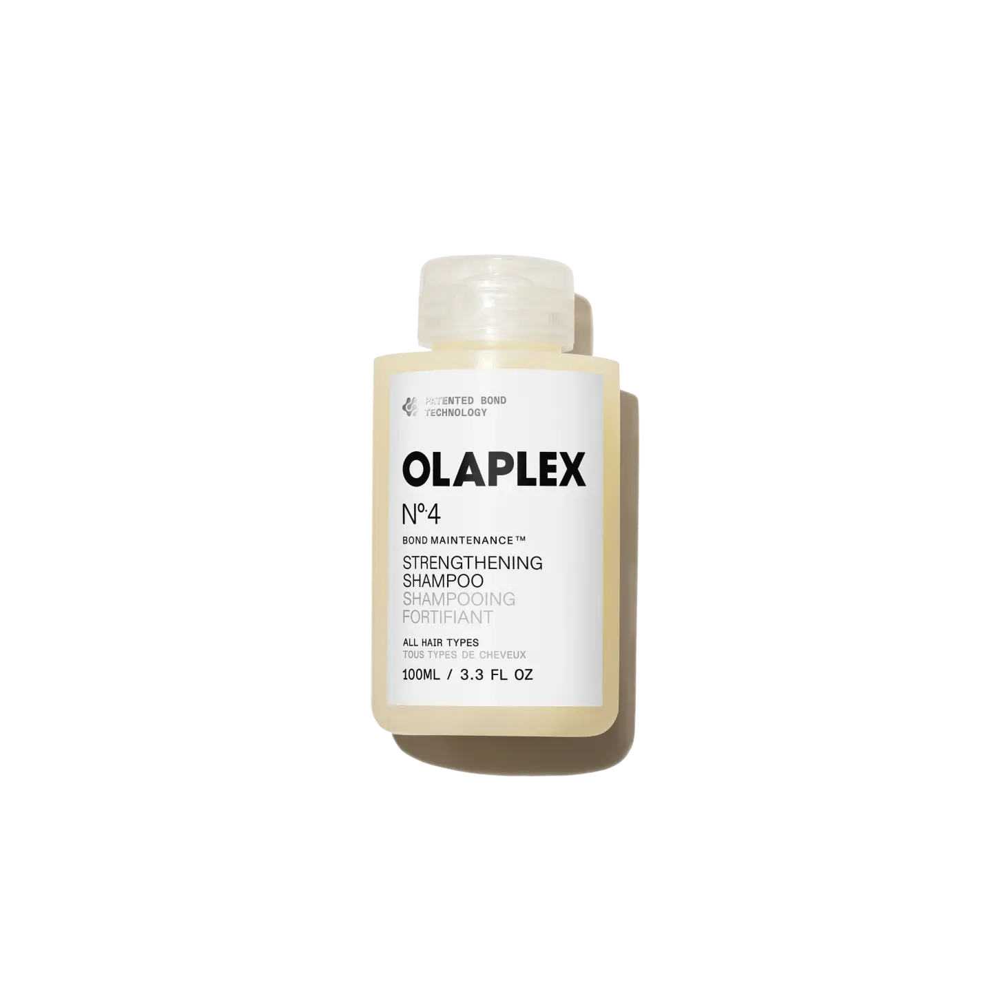 OLAPLEX Nº.4 Bond Maintanence Strengthening Shampoo TRAVEL SIZE - A multi-action shampoo for stronger, defined, and more hydrated coils, curls, and waves in one use.