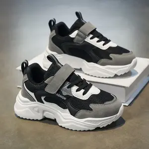 Kids’ black-and-gray colorblock dad sneakers featuring breathable mesh, anti-slip soles, lightweight design, and easy Velcro fastening/removal. Mesh panels offer comfort even during prolonged wear and are abrasion-resistant. Unisex casual shoes suitable f