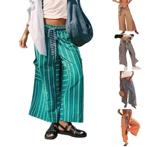 Women’s striped drawstring lounge pants with a loose wide leg and pockets, casual palazzo style for summer vacation wear