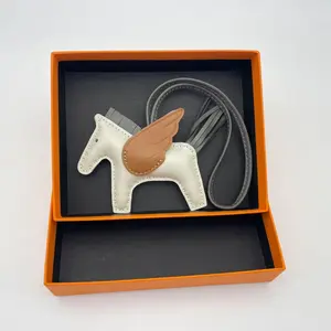 Versatile and fashionable bag charm in the shape of a little horse, in classic color schemes Versatile and fashionable bag charm in the shape of a little horse, in classic color schemes