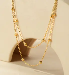 The retro double-layer stacked Little Bean necklace is a niche collarbone chain fashion accessory