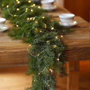 CLYCALOOR 6FT Christmas Garland Cedar with 9.8FT LED Light String Artificial christmas home decor , Real Touch Winter Pine Garland, Green Artificial Greenery Garland for Table, Mantle, Wall, Indoor, Outdoor Christmas Decorations Festive Holiday Seasonal