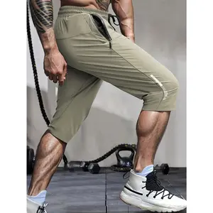 Men's high elasticity drawstring zipper pocket seven inch sports pants Summer loose and breathable fitness running casual cropped pants Multi colored straight leg multi pocket outdoor commuting sports captcha pants