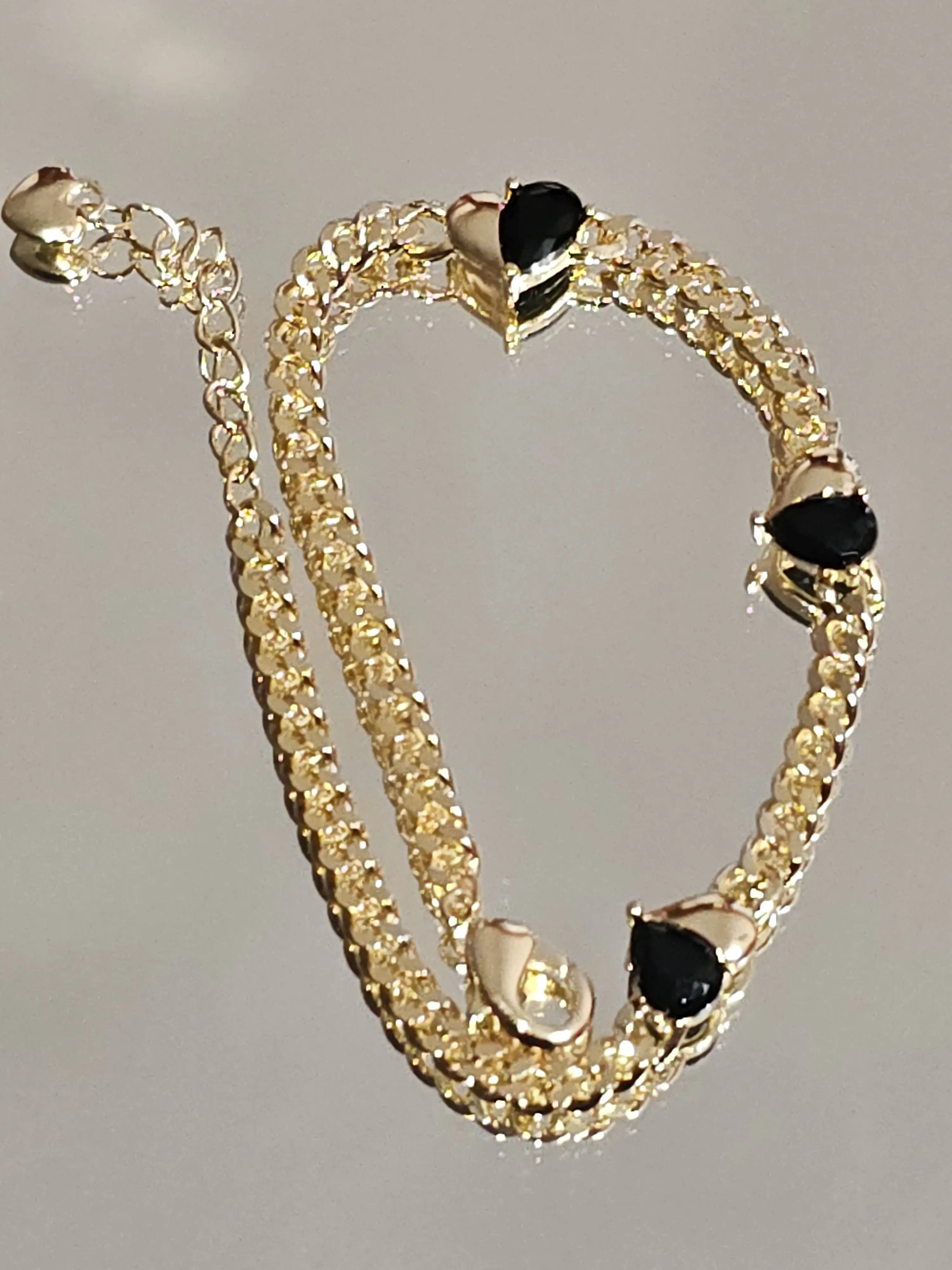 8 inches long, Black Synthetic Zircon Hearts Curb Link style Bracelet, copper 14K Gold plated, weighs 6.5 grams not water resistant