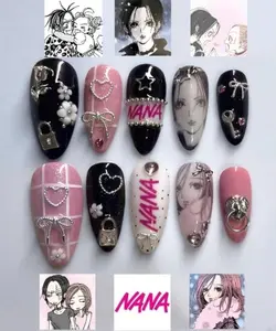 NANA Inspired Nails – Bold pink, black, and white tones with chains, hearts, and portraits capturing the punk-romantic essence of Nana Osaki and Nana Komatsu’s iconic style.
