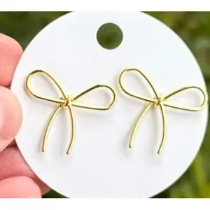 Golden Bow Earrings – The Stealthy Statement Maker 🎀✨