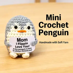 A charming, handcrafted crocheted wool penguin—accompanied by a heartfelt message card—makes for the perfect little Mother's Day gift.
